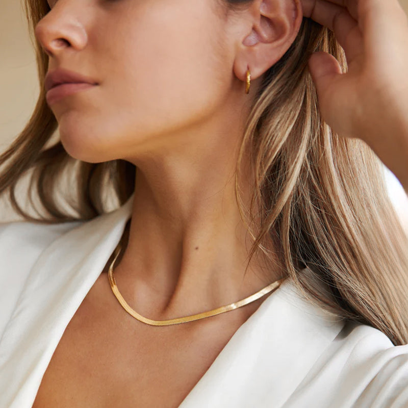Woman wearing the Cleopatra 4MM Necklace in 18K gold plating, in natural light