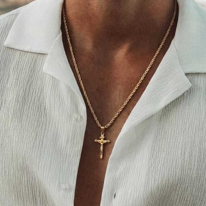 Close-up of the 18K gold plating on the Corpus Cross Necklace, mirror finish
